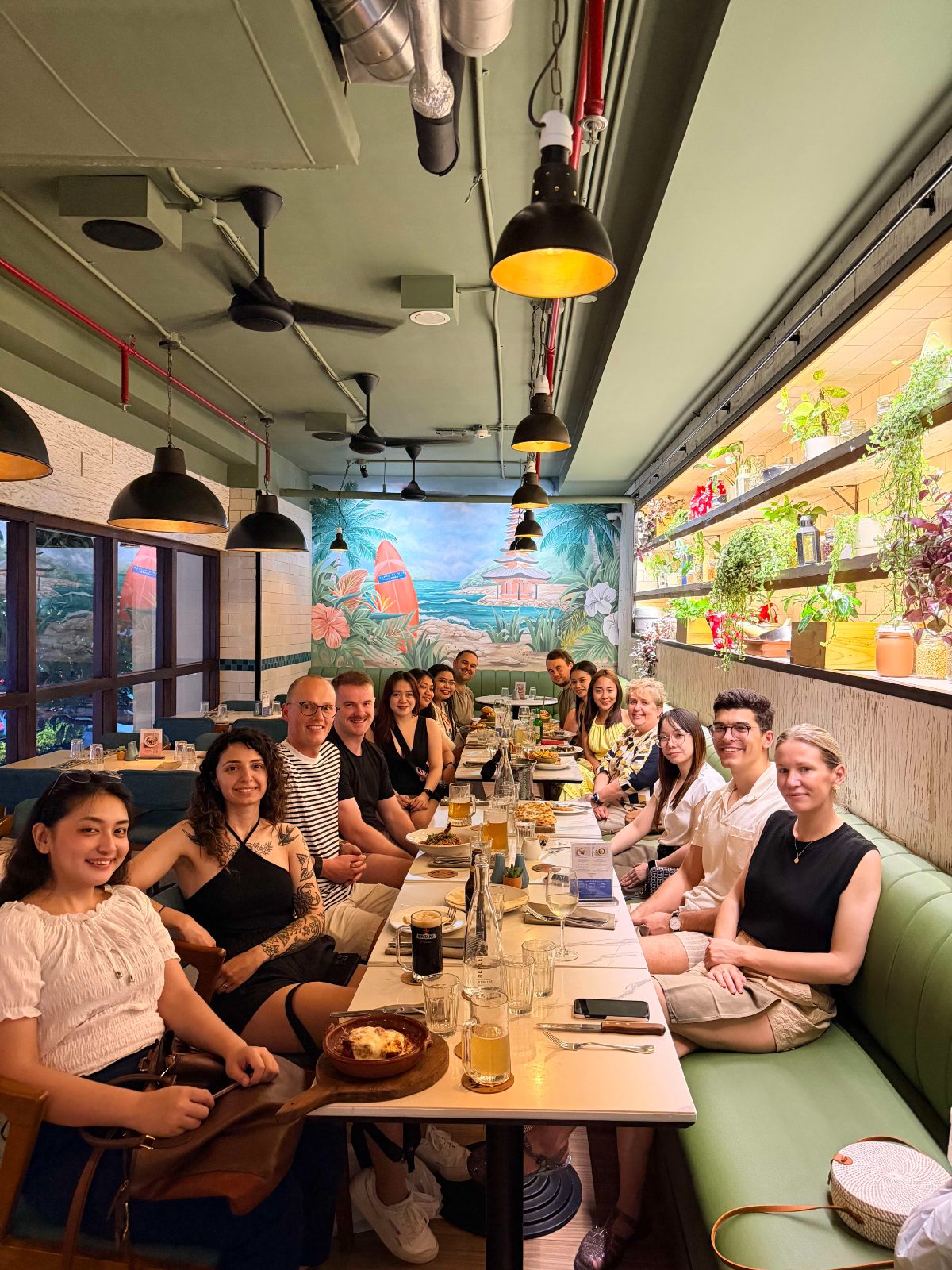 The FGS team at a long dinner table on a company retreat